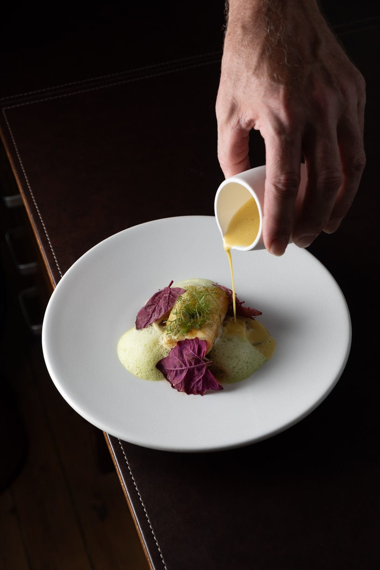 Plating a dish at Com'Ça